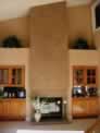 Double sided Fireplace Faux Finished in a light Stone